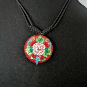 vintage Chinese cloisonné pendant necklace featuring a red enamel background 